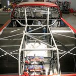 This overhead view of the Chevy's bed area shows off the intricate chromoly tubing that makes up the truck's rear half, the two Koni coilover shocks used to suspend the swing arm, and the truck's batteries, mounted to the rear for optimal weight distribution.