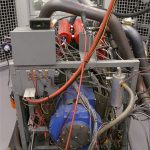 The Superflow dynamometer is a water-break dyno, which uses water pressure (in the blue absorber at the rear of the engine) to put a load on the engine during tests. That load simulates the resistance the engine will feel in the real world when it tries to accelerate the vehicle. The dyno measures the engine’s torque output by gauging the crankshaft’s twisting action against that load.
