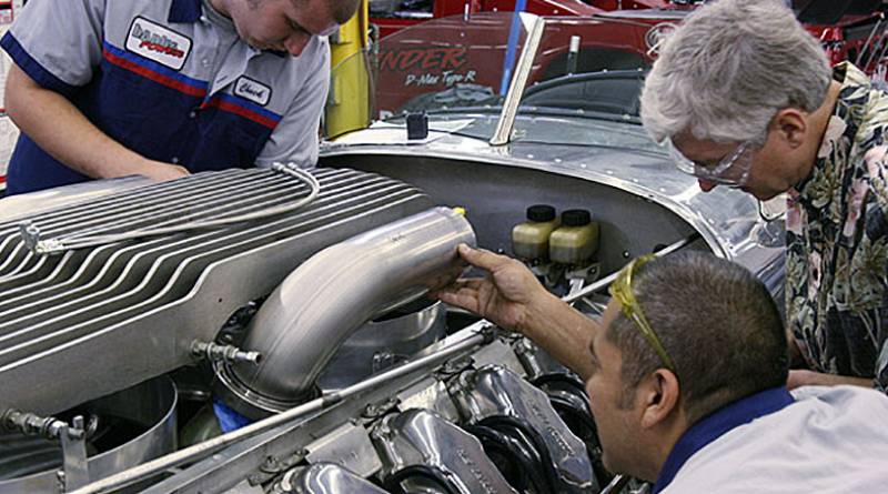 Leno7-waste1_lg Our first task on the "hot" side of the Tank Car's turbo system was to route tubing from the exhaust manifolds to the turbochargers. We started by replacing the original mild steel tubing with stainless tubing and installing a V-band flange at the exhaust manifold outlet. Fabricator Daniel Dominguez and Bob Robe check the angle and elevation of the initial bend section.