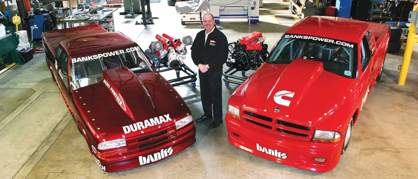 Gale Banks with two key vehicles important to the company history.