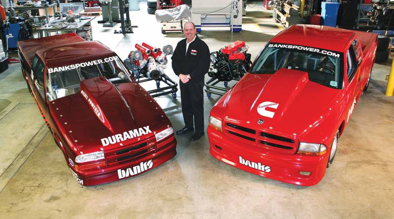 Gale Banks with two key vehicles important to the company history.