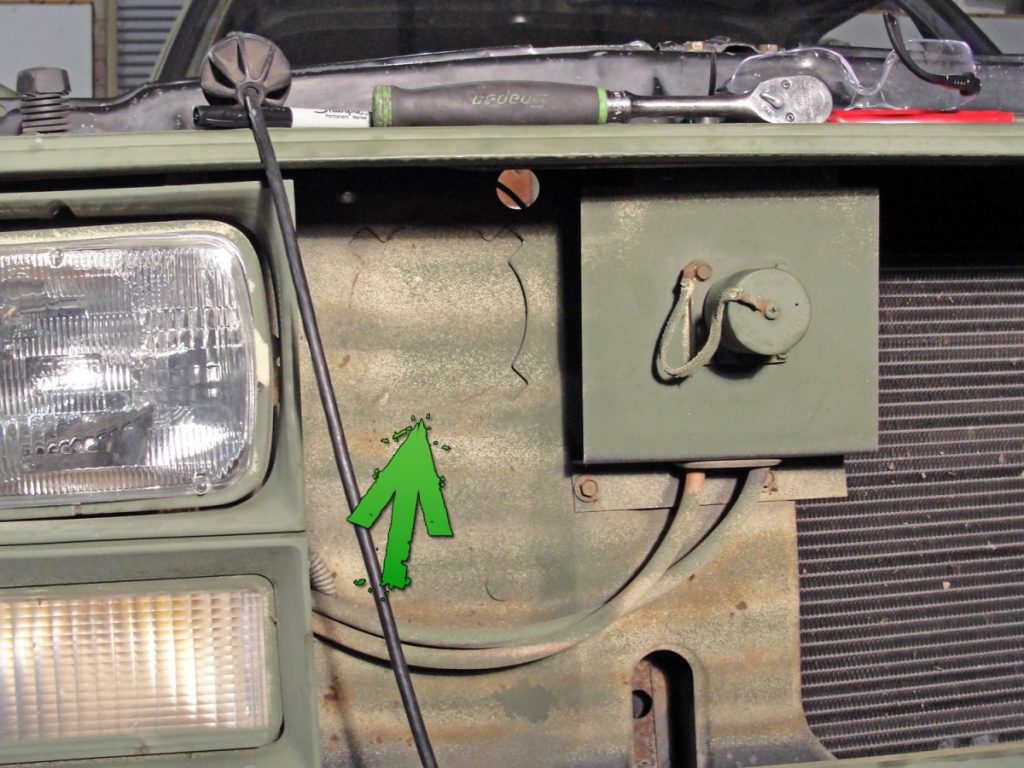 The new airbox assembly gets its fresh flow of air through an inlet duct in the radiator support. If not removed (as in this case) the duct is pre-punched and requires removal before you can install the plastic inlet hood.