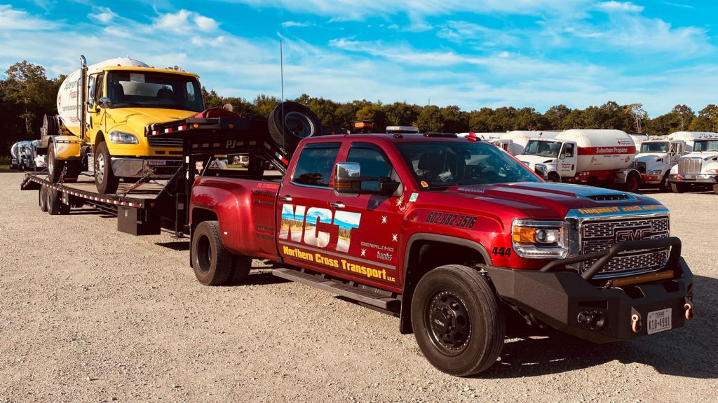 The Alaskan Duramax hauls another work truck.