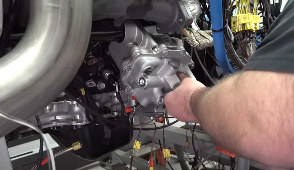 Installing the new oil cooler.