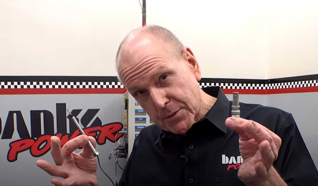 Gale holds up the Kistler Pressure Transducer sensor used in the damage check.