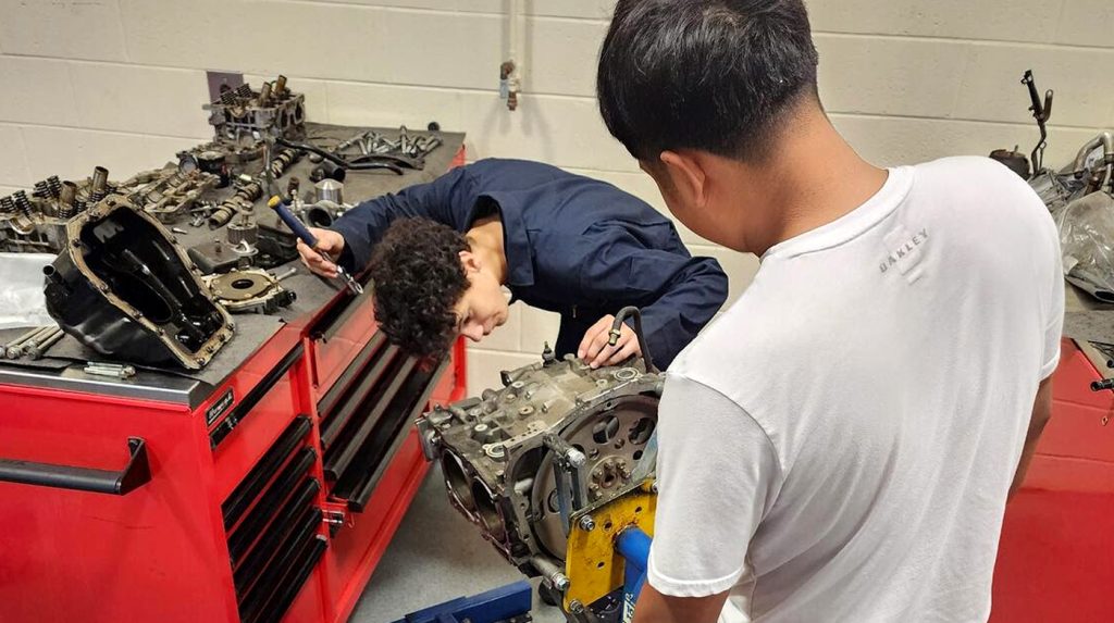 Teaching students about engine blocks.