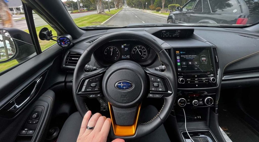 The cockpit of the Subaru displaying the Banks iDash.