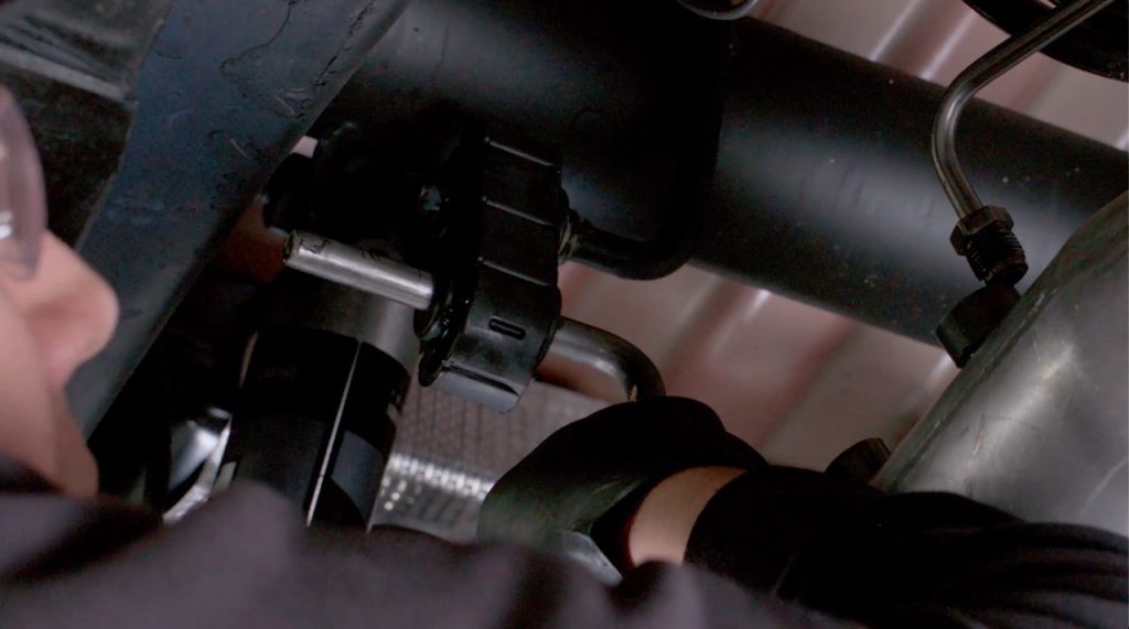 Engage the hangers to the OEM bushings.