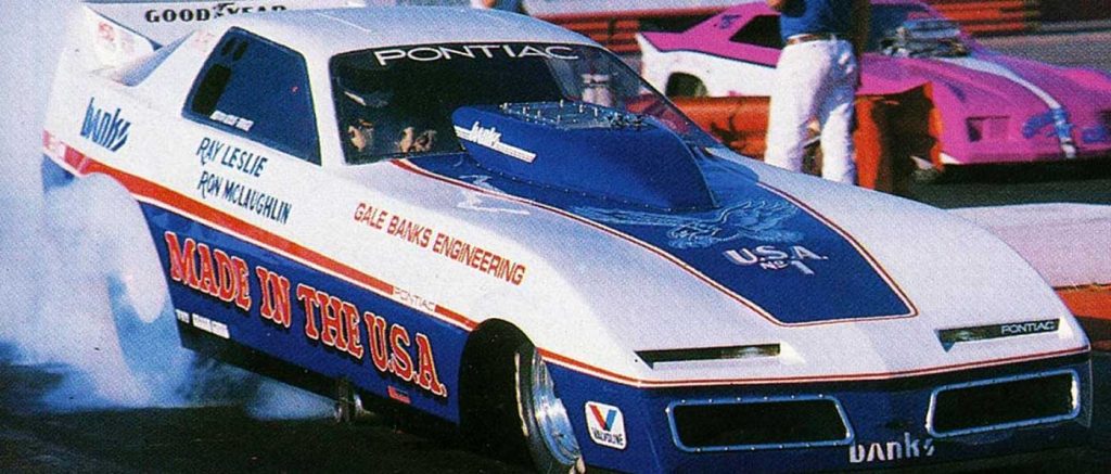 Exterior of the MADE IN THE USA top alcohol funny car on the starting line.
