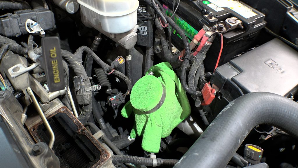Place rag over boost tube