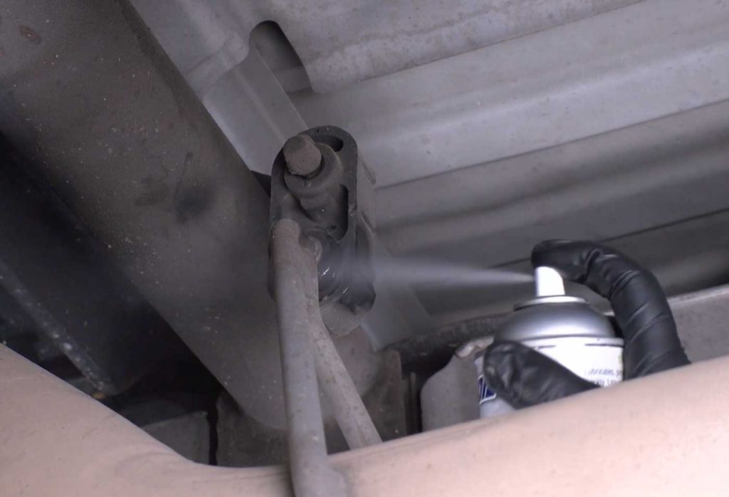 Move back to the front hanger and remove that hanger pin. Once that is free, completely remove the factory exhaust pipe from the truck.