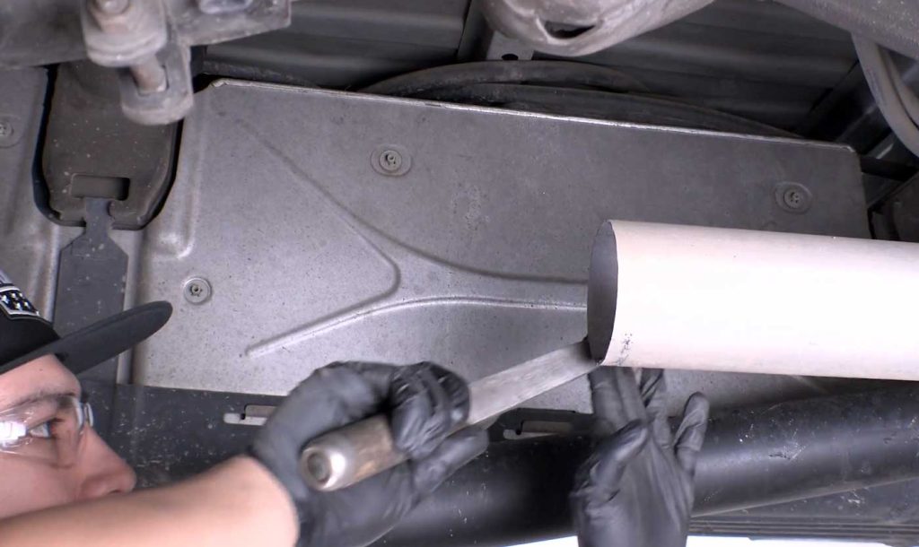 File the rough edges of the cut line from the remaining stock exhaust.