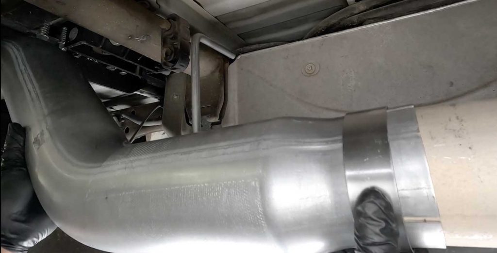 Insert the front tailpipe over the stock exhaust and adjust until it's snug but not torqued.