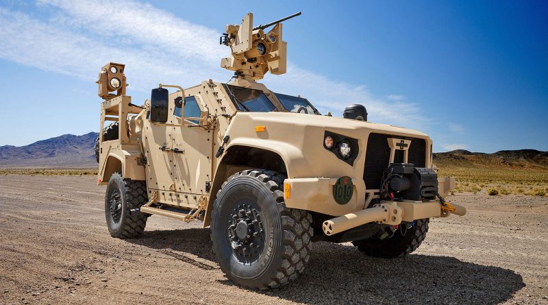 jltv-desert-hero-shot JLTV parked in a desert landscape with gun at the ready.