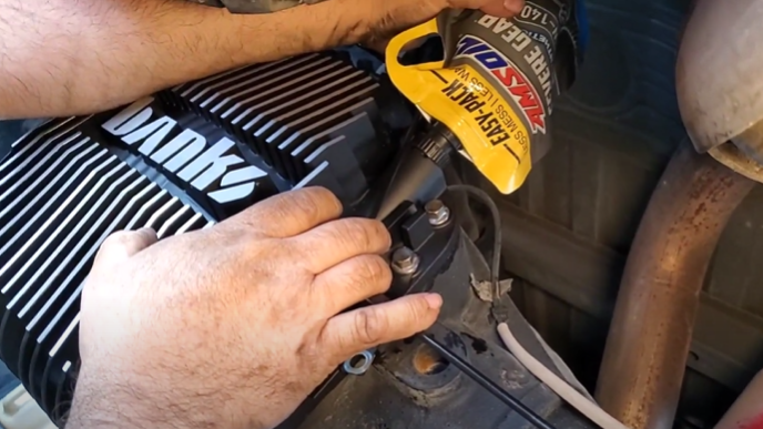 Banks Ram-Air Differential Cover being installed on a 2021 Ford F-250 Tremor using premium synthetic gear oil.