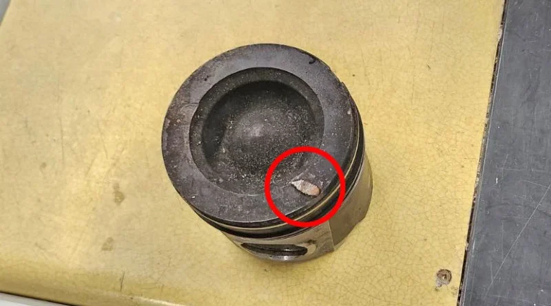 doug-piston-1.jpg RAM engine piston embedded with grid heater bolt