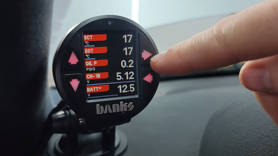 Tyler Ovens installs iDash SuperGauge and sensors in a 2003 BMW X5 for real-time engine data monitoring.