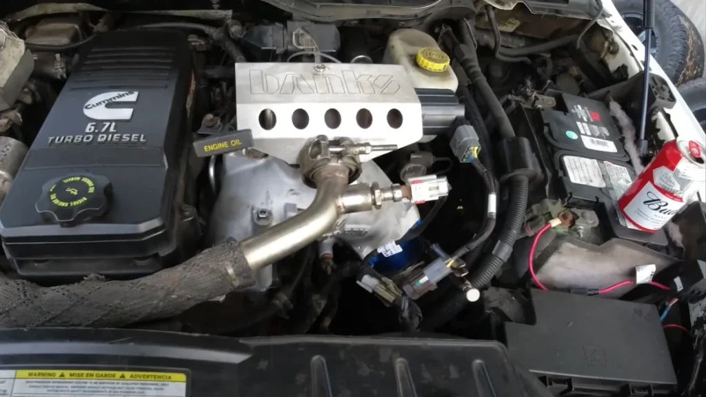 The engine bay of a heavily modified 2006 Dodge RAM 2500, featuring the Banks Monster-Ram intake.